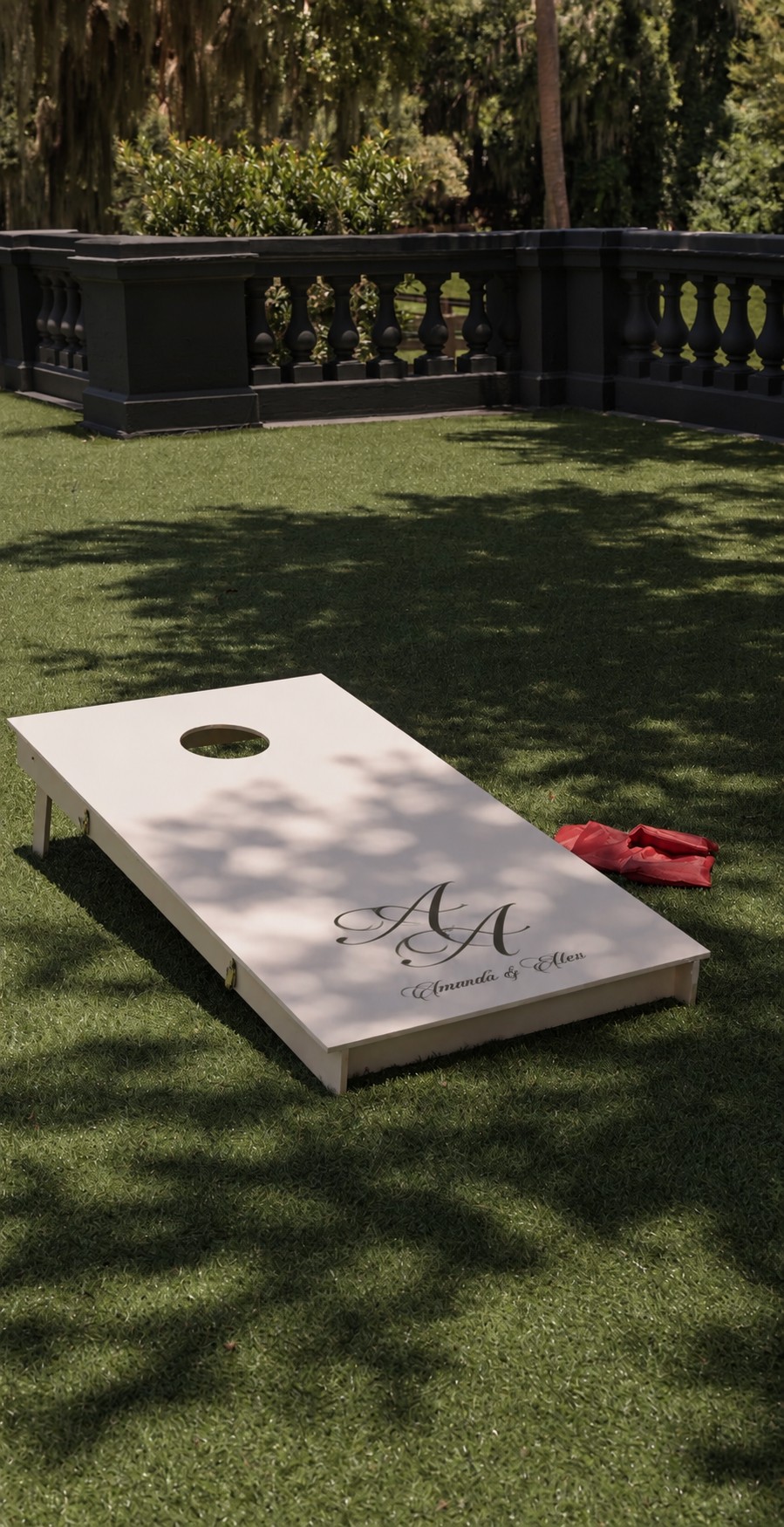 Personalized wedding cornhole board on a lawn